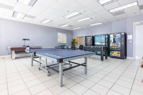a gaming room with a ping pong table and a piano at Super Cool 1BR Apartment in Brickell with Parking in Miami