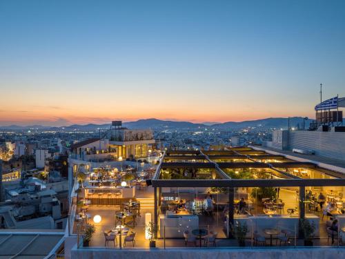a view from the rooftop of a building at night at The Stanley in Athens