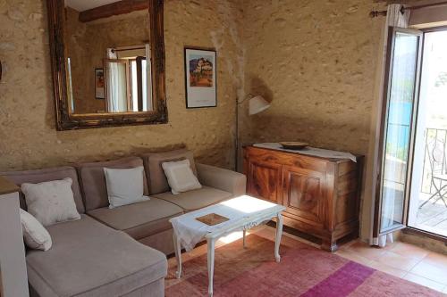 a living room with a couch and a table at Lou Marcelou - Apartment One in Sainte-Croix-de-Verdon