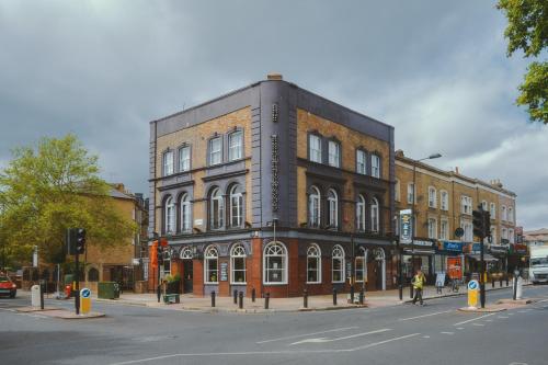 a large brick building on a city street at The Brownswood in London