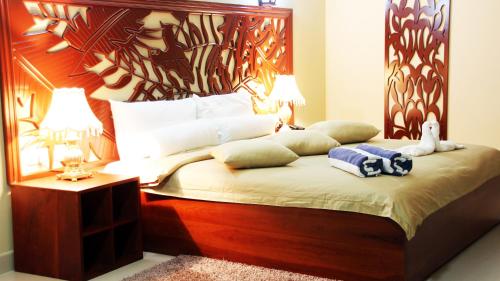 Кровать или кровати в номере Pirogue Lodge
