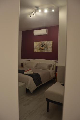 Postel nebo postele na pokoji v ubytování B&B L'incanto degli Artisti