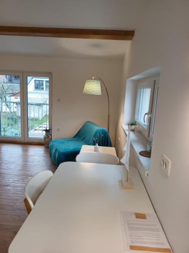 a bedroom with a large bed and a couch at Accommodation Baron in Ljubljana