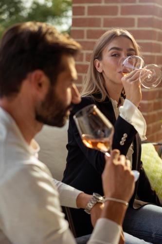 a man and a woman drinking wine together at Sunset Residence in Brenzone sul Garda