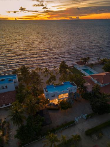 an aerial view of a resort and the ocean at sunset at Quinta del Mar La Joya in Tolú