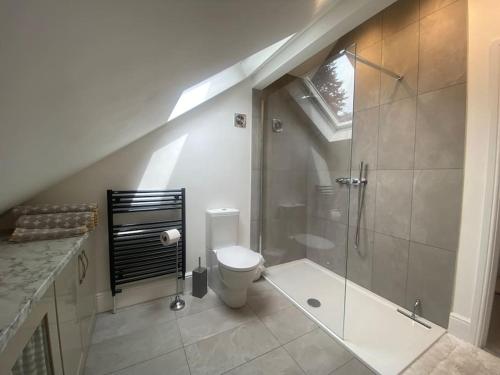 a bathroom with a shower and a toilet at Beautiful 1 bedroom holiday home in Lancaster in Lancaster