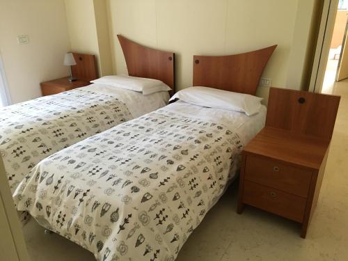 Posteľ alebo postele v izbe v ubytovaní Aparthotel Manfrè