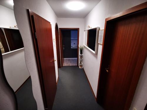 a hallway with two doors and a hallway sidx sidx sidx at Haus Kalli in Walkenried