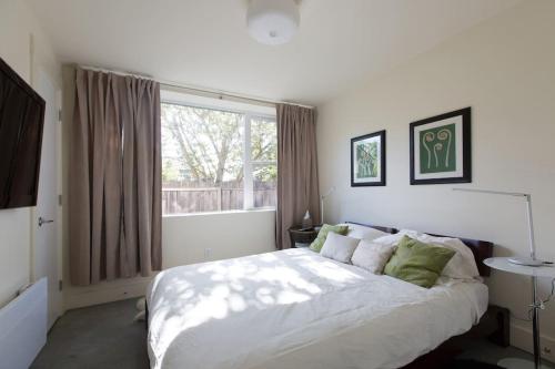 a bedroom with a large bed and a window at LEED Platinum Green Home Getaway in Seattle