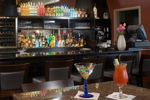 a bar with two glasses on a table at Best Western Sunrise Inn & Suites in Stony Plain
