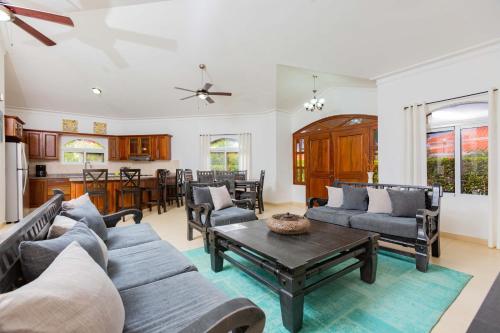 a living room with a couch and a table at Sosua Ocean Village Properties by Calisto Stays in Sosúa