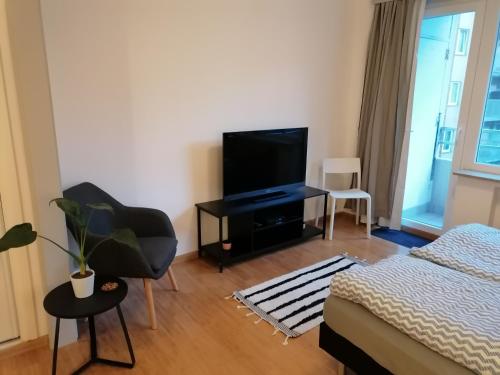 TV a/nebo společenská místnost v ubytování studio oostende aan zee
