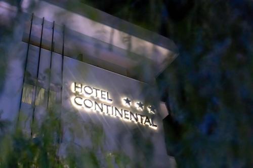 a sign that says hotel act commential on a building at Hotel Continental in Tortoreto Lido