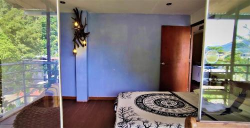 Ένα ή περισσότερα κρεβάτια σε δωμάτιο στο VAGO HOSTEL