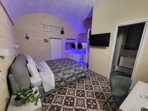 Una televisión o centro de entretenimiento en QUART0 GREC0 Suite 17