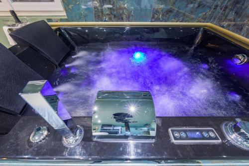 a box with a device on top of a table at Le Musée d’Aphrodite / JACUZZI in Montgeron