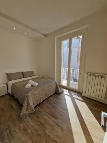 A bed or beds in a room at Amiura B&B