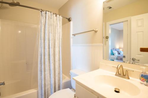 a bathroom with a sink and a toilet and a shower at Sands IV 2-G in Carolina Beach
