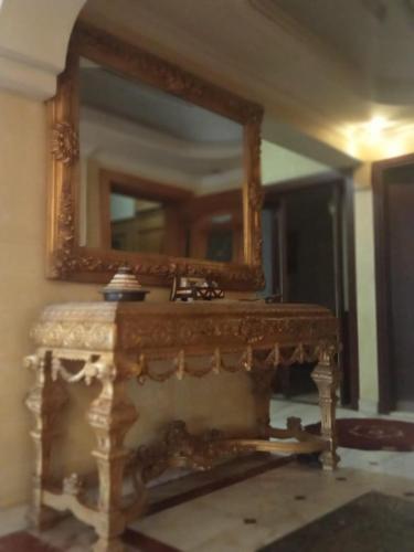 a mirror on top of a table in a room at Style home in Cairo