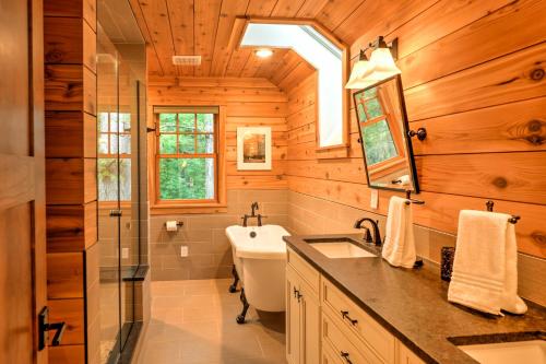 a bathroom with a sink and a shower and a toilet at Sugar Berry-Remodeled Laughlintown Craftsman Home! in Laughlintown
