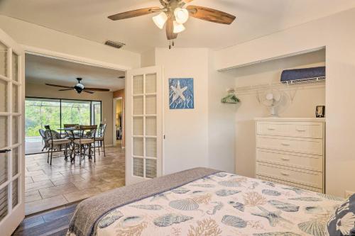 a bedroom with a bed and a ceiling fan at Pet-Friendly Fort Myers Home with Heated Pool! in North Fort Myers