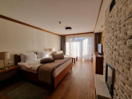 Ένα ή περισσότερα κρεβάτια σε δωμάτιο στο Apartman aparthotel Vučko