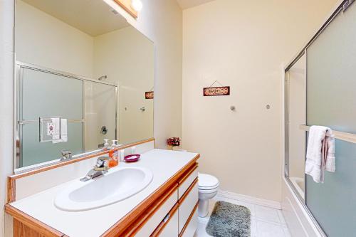 a bathroom with a sink and a shower at Rhody Apartment in Florence