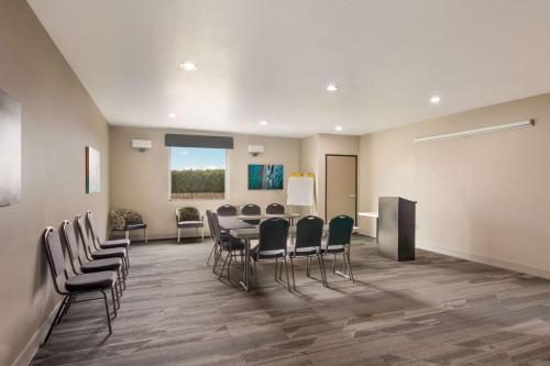 a conference room with a table and chairs and a podium at Best Western Plus Killeen - Fort Cavazos Hotel & Suites in Killeen
