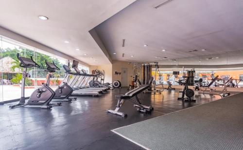 a gym with treadmills and exercise equipment in a building at Holiday Inn Merida by IHG in Mérida