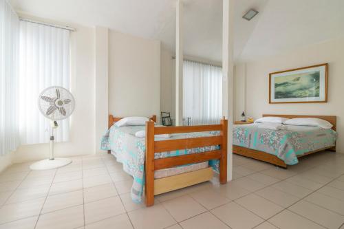Postel nebo postele na pokoji v ubytování Oceanic Lodge