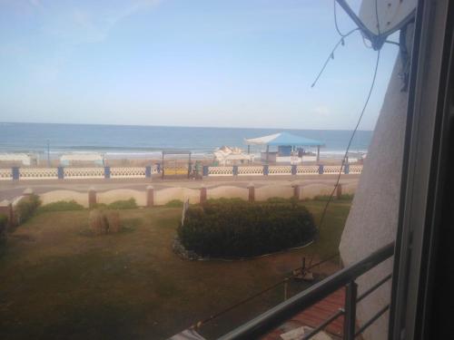 a view of the ocean from the balcony of a house at ستوديو المعموره Jerma apartments in Alexandria
