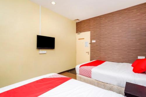 Postel nebo postele na pokoji v ubytování D'Pinetrees Hotel