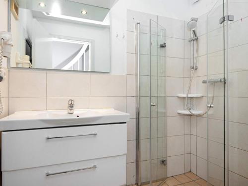a bathroom with a sink and a shower at Two-Bedroom Holiday home in Wendtorf 6 in Wendtorf