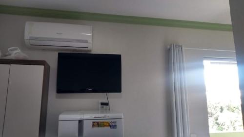 TV a/nebo společenská místnost v ubytování Pousada da Sônia