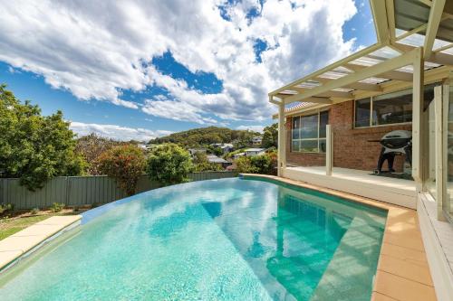 a swimming pool in the backyard of a house at 36 Churchill in Forster