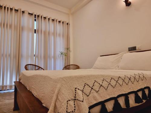 Кровать или кровати в номере Sandil Surf house