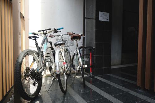 two bikes parked next to each other in a hallway at Kyoto Riverview House Kyoraku in Kyoto