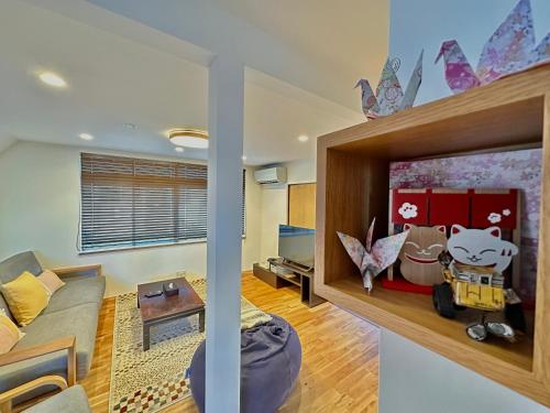 a living room with a couch and a table at Haku Wakanayanagi Inn in Kyoto