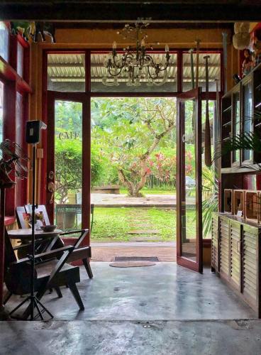 an open door to a room with a view of a garden at Casa San Pablo B & B in San Pablo