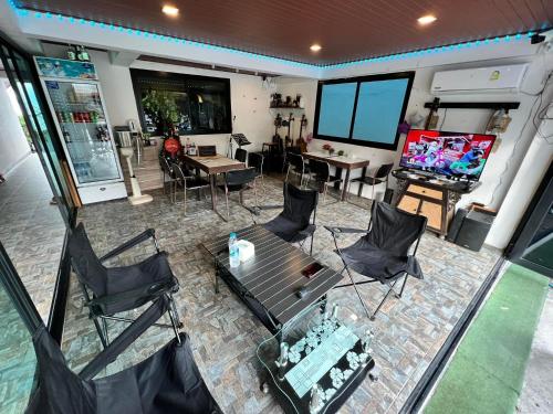 an overhead view of a room with a table and chairs at The Shore Samui in Bang Rak Beach