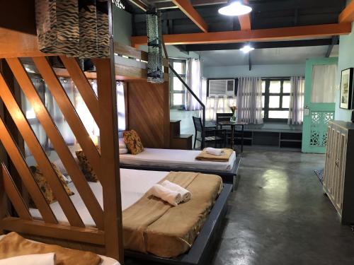 a room with two bunk beds and a table at Casa San Pablo B & B in San Pablo