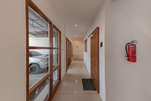 a hallway with a car parked in a room at Urbanview Hotel Cozy Samarinda by RedDoorz in Samarinda