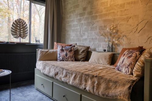 Гостиная зона в Lodge in een bosrijke omgeving met Hottub & Sauna opt