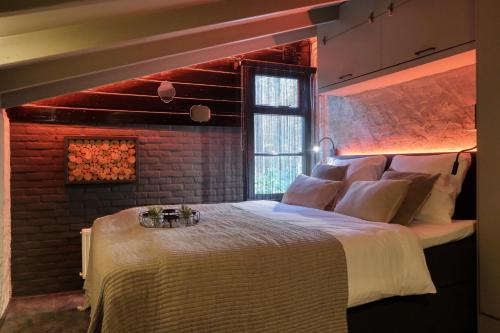 Кровать или кровати в номере Lodge in een bosrijke omgeving met Hottub & Sauna opt