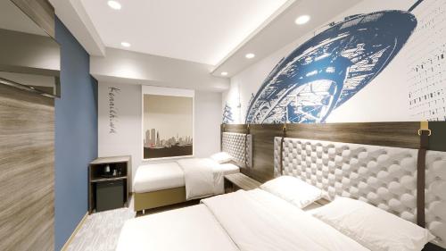 a bedroom with two beds and a mural at Travelodge Nagoya Sakae in Nagoya