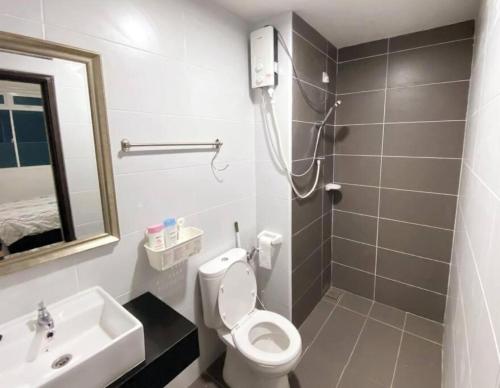 a bathroom with a toilet and a sink and a shower at Vesta Homes, KSL Residences Taman Daya, Johor Bahru in Johor Bahru