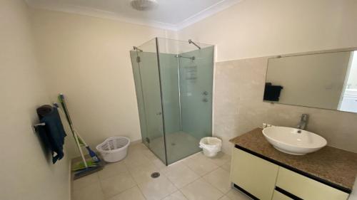 a bathroom with a glass shower and a sink at Unit 64 Seafront Estate in Jurien Bay
