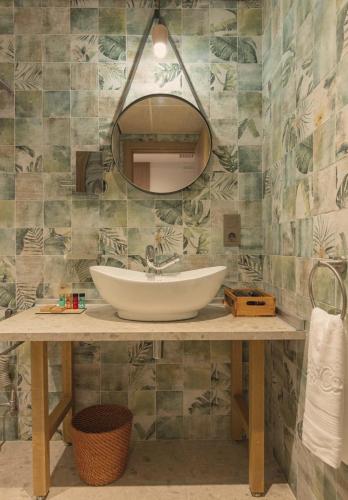 a bathroom with a sink and a mirror at Casa Coco Boutique Hotel & Spa 4*S - Adults Only in Lloret de Mar