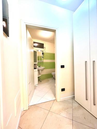 a bathroom with a toilet and a sink at Limone DownTown in Limone sul Garda