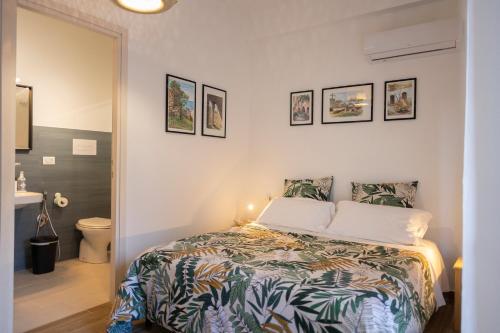 Ένα ή περισσότερα κρεβάτια σε δωμάτιο στο Baronetto B&B